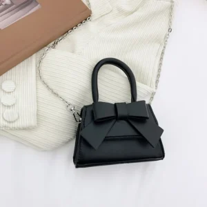 Nouvelle boutique enfants portent couleur unie nœud en cuir Pu princesse épaule Messenger sacs à main pour les filles - Noir