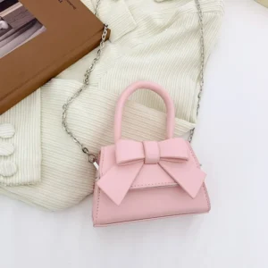 Nouvelle boutique enfants portent couleur unie nœud en cuir Pu princesse épaule Messenger sacs à main pour les filles - Rose